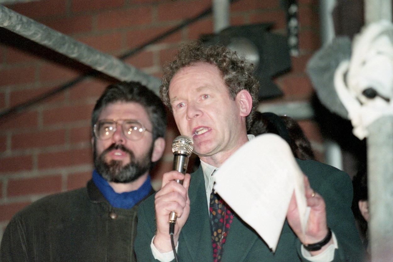 Sinn Fein deputy leader Martin McGuinness, with Gerry Adams behind him, in 1994-ap.jpg