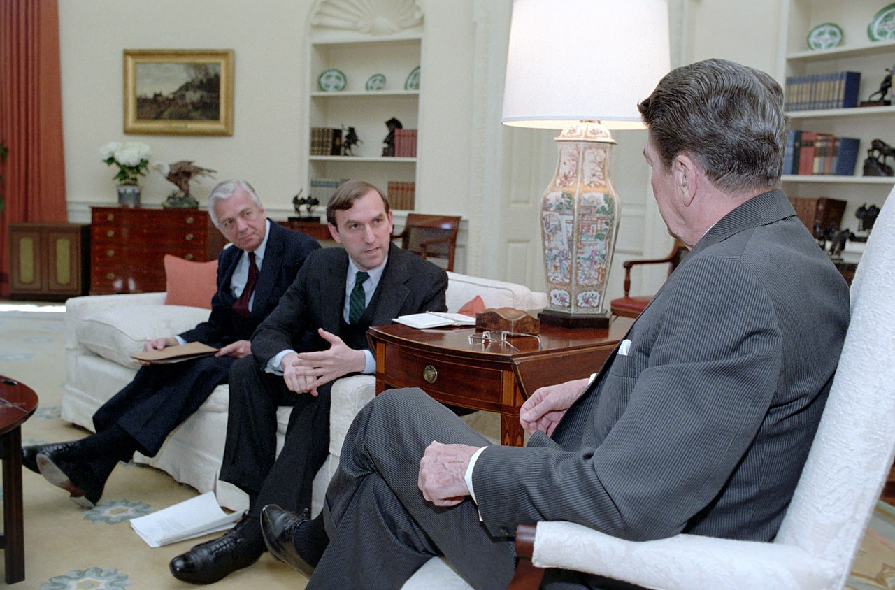 1280px-President_Ronald_Reagan_Meeting_with_Elliott_Abrams_About_Trip_to_Central_America_with_John_Whitehead  national archive.jpg